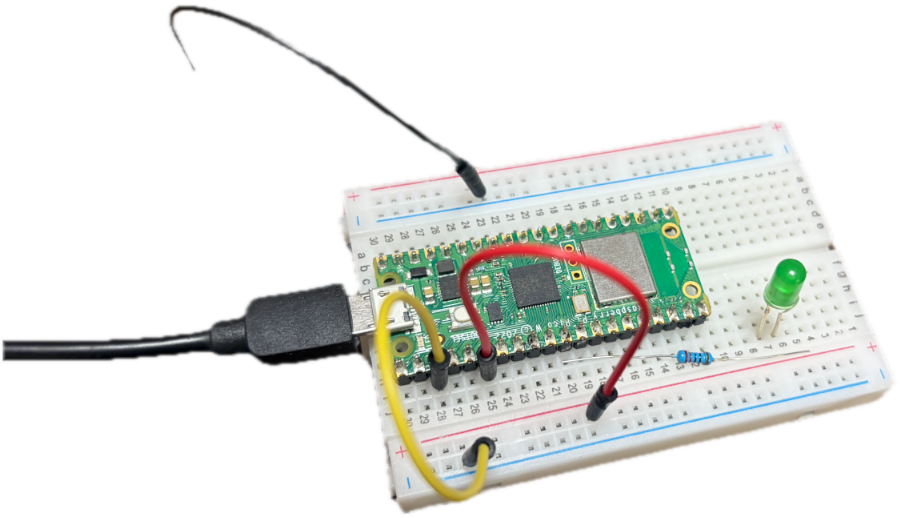 ブレッドボードに組んだRaspberry Pi Picoと、光っている緑のLED